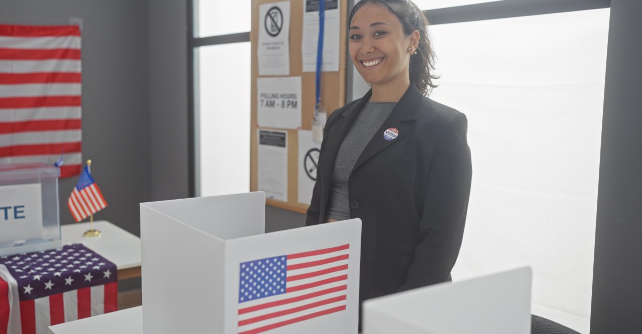 Smiling woman at a voting booth