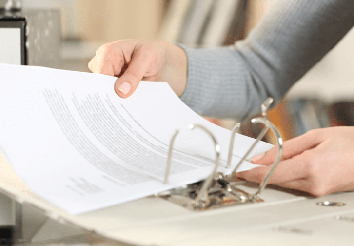 woman going through binder