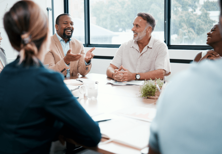 a group of people working together in an office