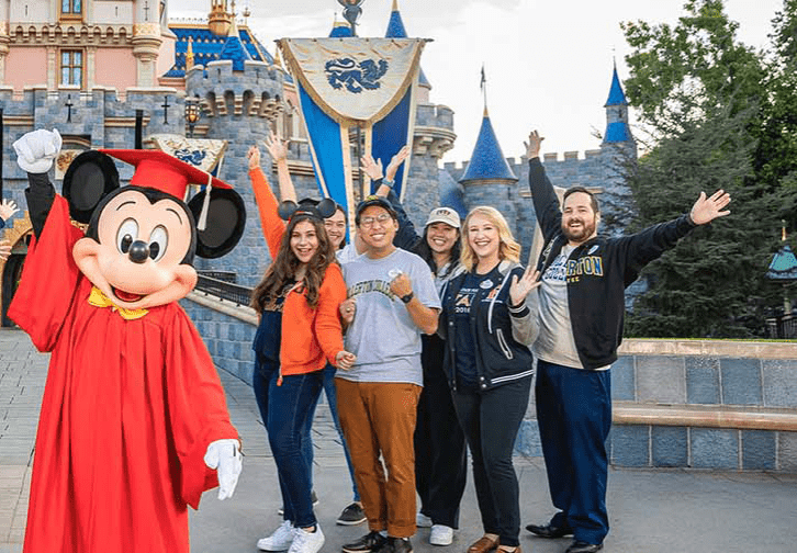 Fullerton College students with mickey mouse at Disneyland