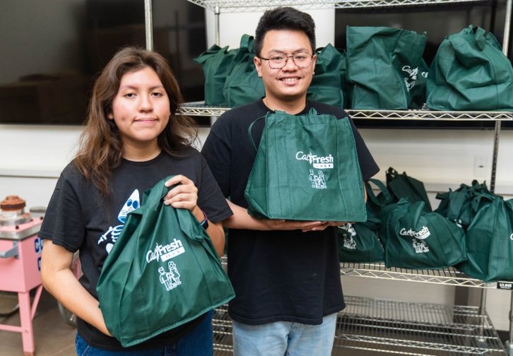 students-holding-grocery-bags