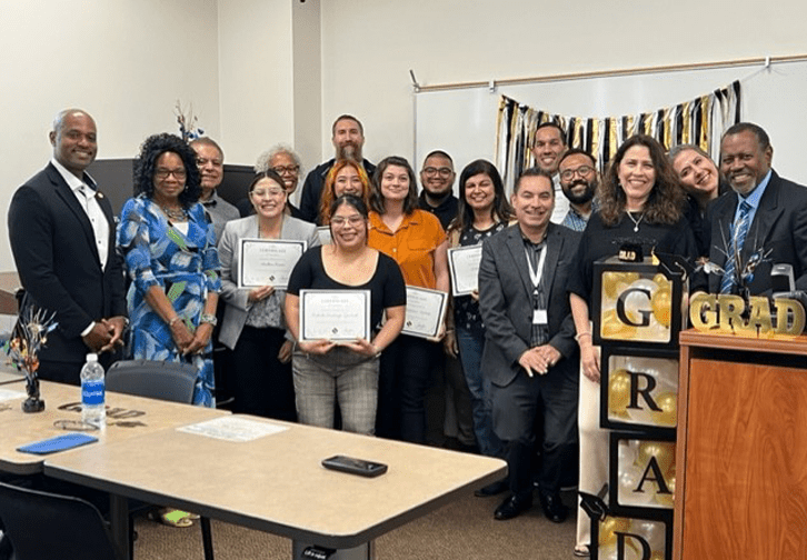 FIT graduates standing together