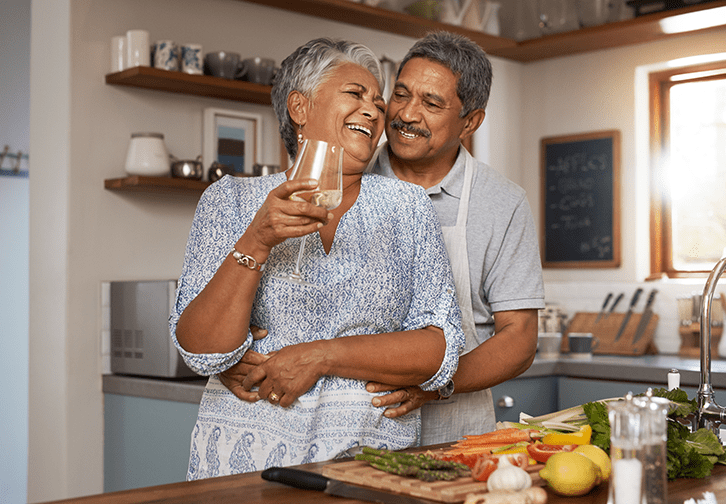 An older couple enjoying embracing