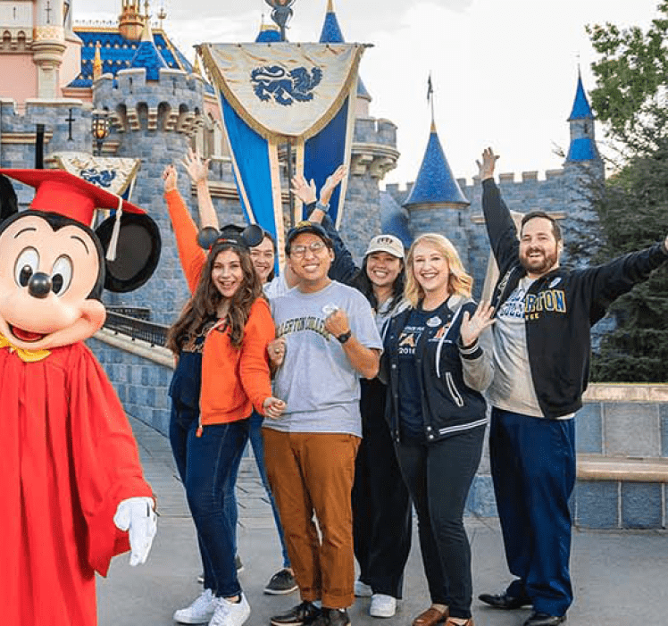 Fullerton College students with mickey mouse at Disneyland