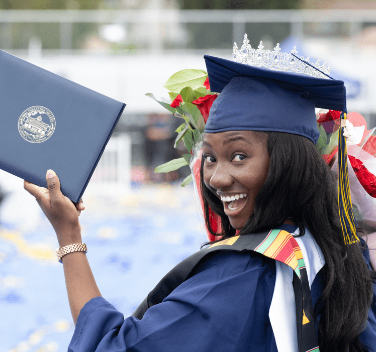 Fullerton College holds diploma and flowers