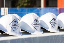 a row of white hard hats