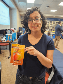 kaitelyn pasillas holds a bag of dried fruit