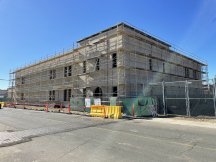 exterior two story building with scaffolding